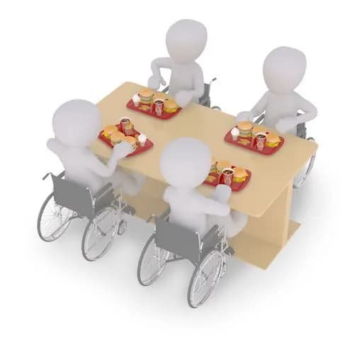 disabled people sitting on a table with 